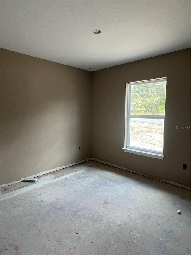 21712 SW Rainbow Lakes Blvd, Dunnellon, FL 34431 - unfurnished room featuring concrete floors