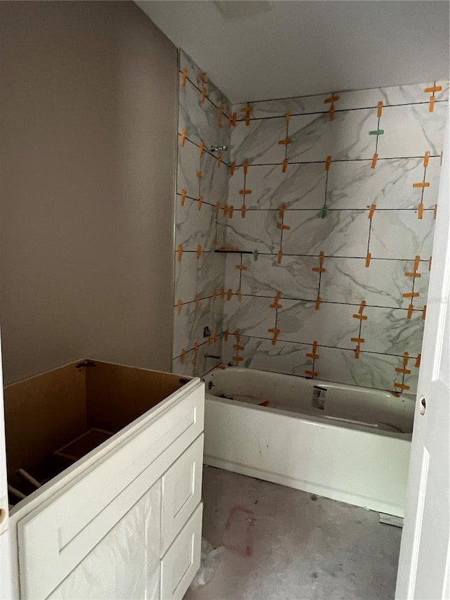 21712 SW Rainbow Lakes Blvd, Dunnellon, FL 34431 - bathroom featuring vanity, tub / shower combination, and concrete floors