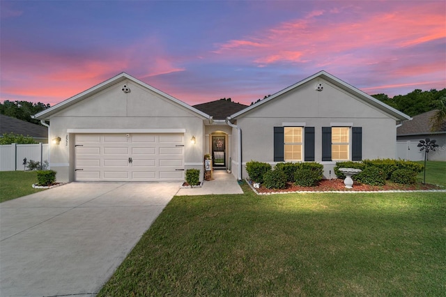 2552 NE 42nd Rd, Ocala, FL 34470 - single story home featuring concrete driveway, stucco siding, and an attached garage