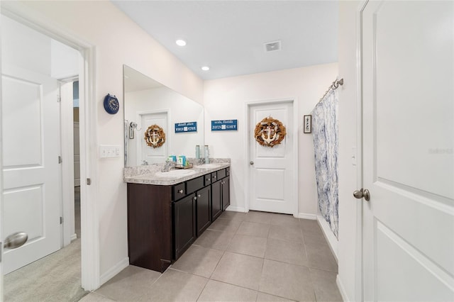 2552 NE 42nd Rd, Ocala, FL 34470 - full bath featuring double vanity, tile patterned flooring, and recessed lighting