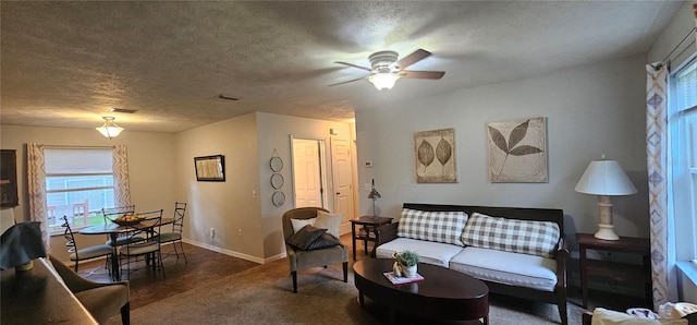 5591 NW 61st Ln, Ocala, FL 34482 - living area featuring a ceiling fan, carpet, plenty of natural light, and a textured ceiling