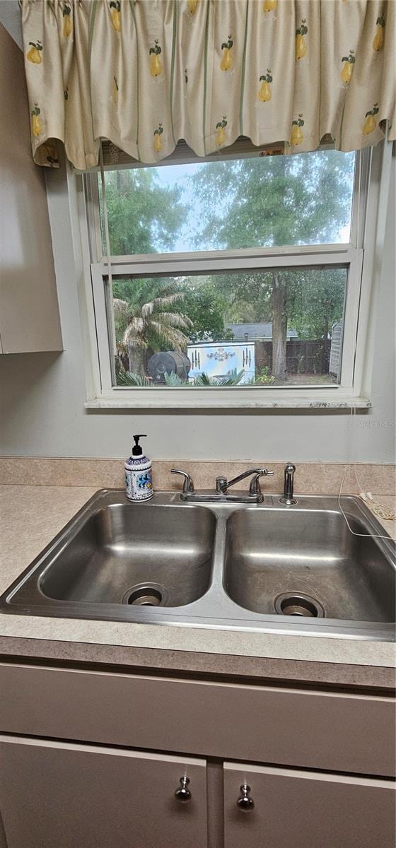 5591 NW 61st Ln, Ocala, FL 34482 - detailed view of gray cabinetry and light countertops