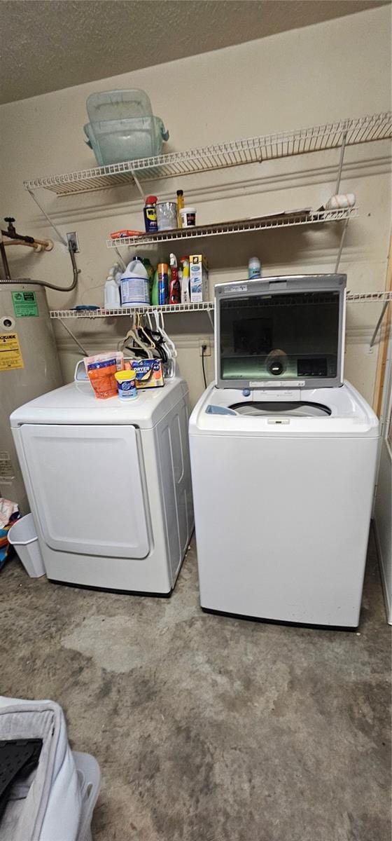 5591 NW 61st Ln, Ocala, FL 34482 - washroom featuring separate washer and dryer and water heater