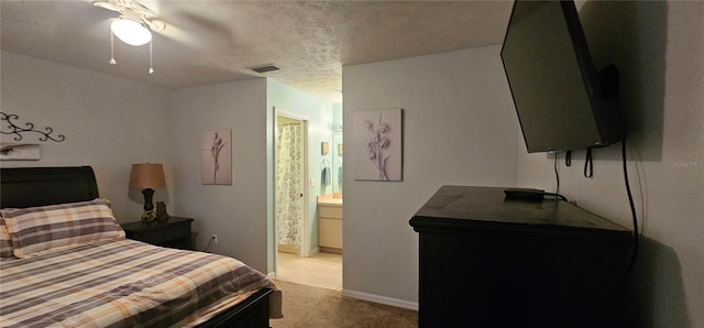 5591 NW 61st Ln, Ocala, FL 34482 - bedroom with carpet, a textured ceiling, ensuite bathroom, and ceiling fan