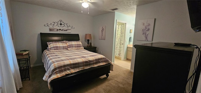 5591 NW 61st Ln, Ocala, FL 34482 - bedroom with light carpet, a textured ceiling, connected bathroom, and a ceiling fan