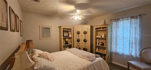 5591 NW 61st Ln, Ocala, FL 34482 - bedroom with dark colored carpet and a ceiling fan