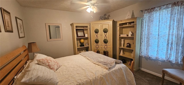 5591 NW 61st Ln, Ocala, FL 34482 - bedroom with dark carpet and a ceiling fan
