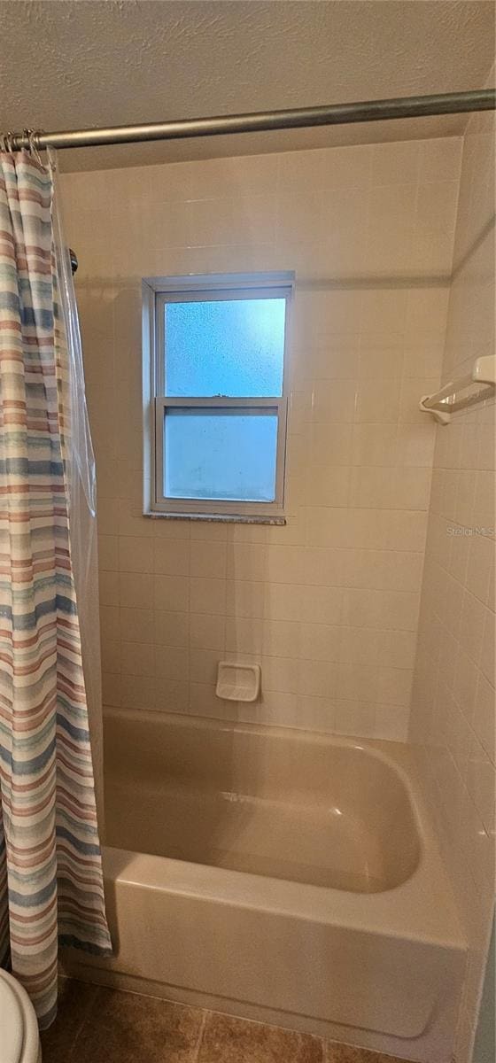5591 NW 61st Ln, Ocala, FL 34482 - bathroom with shower / bath combo and tile patterned floors