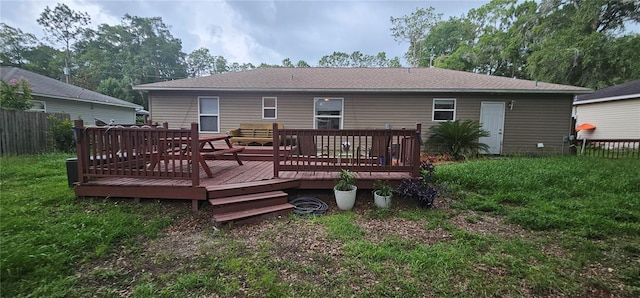 5591 NW 61st Ln, Ocala, FL 34482 - back of property with a wooden deck and a shingled roof