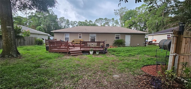 5591 NW 61st Ln, Ocala, FL 34482 - rear view of property featuring a wooden deck and oil tank