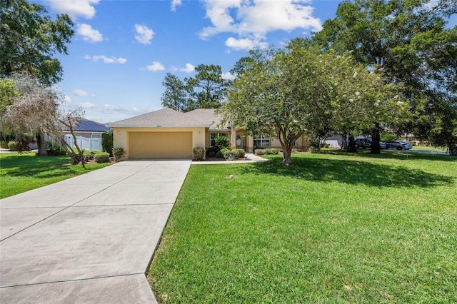 4300 NW 4th Cir, Ocala, FL 34475 - view of front of home featuring stucco siding, an attached garage, driveway, and a front lawn