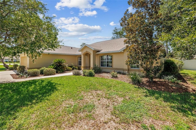 4300 NW 4th Cir, Ocala, FL 34475 - ranch-style house featuring stucco siding, a front yard, and a shingled roof