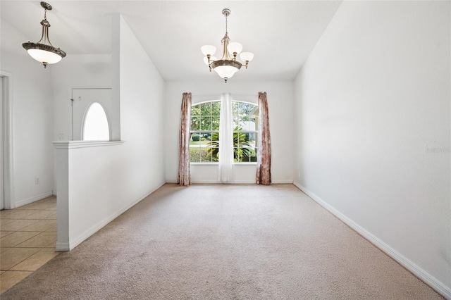 4300 NW 4th Cir, Ocala, FL 34475 - unfurnished room featuring a chandelier, plenty of natural light, carpet, and tile patterned flooring