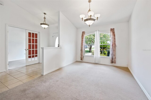 4300 NW 4th Cir, Ocala, FL 34475 - carpeted empty room with a chandelier, lofted ceiling, and tile patterned flooring