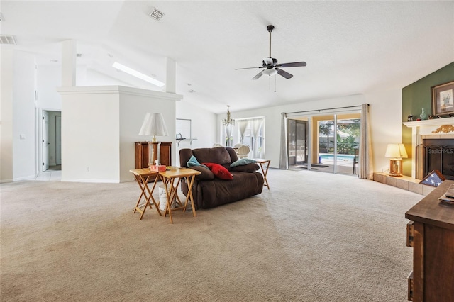 4300 NW 4th Cir, Ocala, FL 34475 - living area with a ceiling fan, light carpet, healthy amount of natural light, a tiled fireplace, and high vaulted ceiling