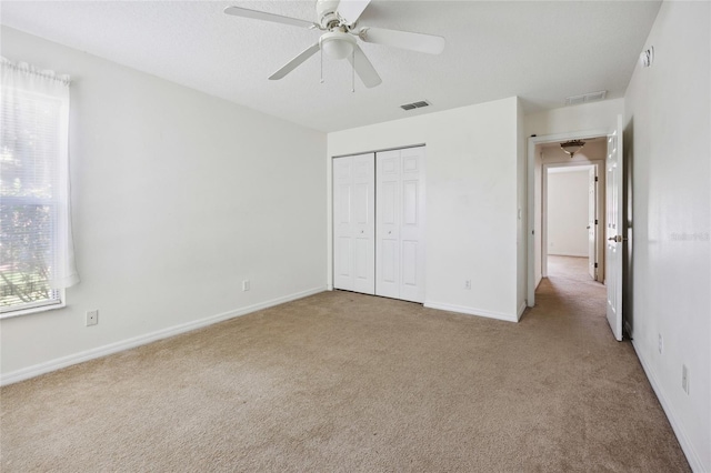 4300 NW 4th Cir, Ocala, FL 34475 - unfurnished bedroom featuring carpet, a closet, and a ceiling fan