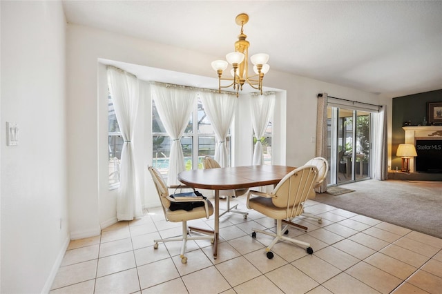 4300 NW 4th Cir, Ocala, FL 34475 - dining room with a chandelier, light carpet, and light tile patterned floors
