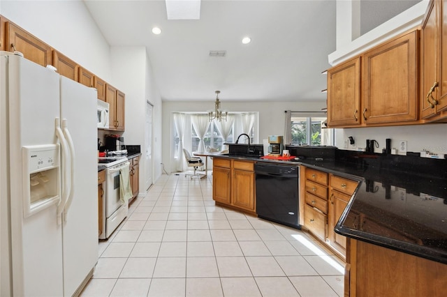 4300 NW 4th Cir, Ocala, FL 34475 - kitchen featuring white appliances, a peninsula, brown cabinetry, a chandelier, and recessed lighting