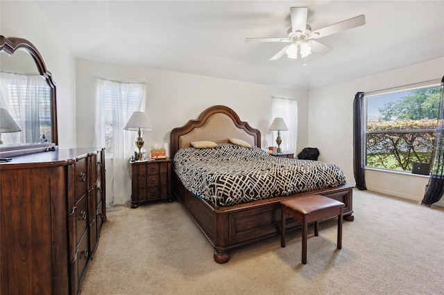 4300 NW 4th Cir, Ocala, FL 34475 - bedroom featuring multiple windows, light colored carpet, and a ceiling fan