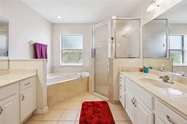 4300 NW 4th Cir, Ocala, FL 34475 - bathroom featuring vanity, a shower stall, a bath, and tile patterned floors