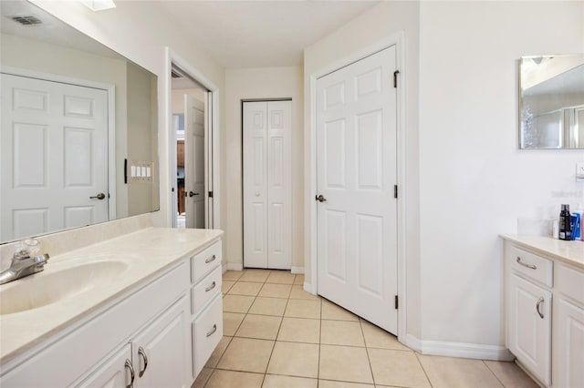 4300 NW 4th Cir, Ocala, FL 34475 - bathroom featuring vanity, tile patterned flooring, and a closet