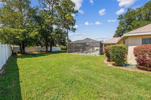 4300 NW 4th Cir, Ocala, FL 34475 - fenced backyard featuring a lanai