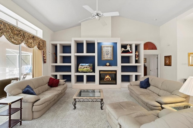4322 N Mayan Dr, Hernando, FL 34442 - living area with carpet flooring, ceiling fan, high vaulted ceiling, and a glass covered fireplace