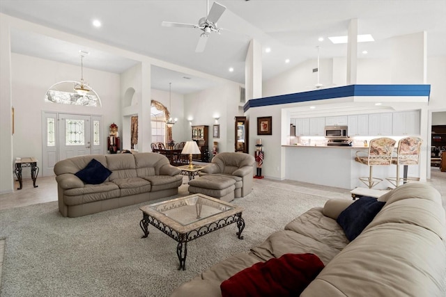 4322 N Mayan Dr, Hernando, FL 34442 - living room featuring a ceiling fan, high vaulted ceiling, recessed lighting, a chandelier, and a skylight