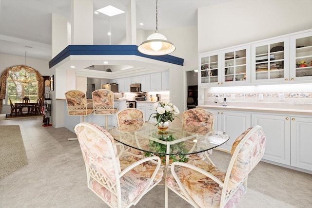 4322 N Mayan Dr, Hernando, FL 34442 - dining area with high vaulted ceiling and recessed lighting