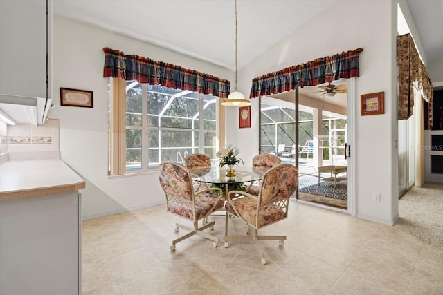 4322 N Mayan Dr, Hernando, FL 34442 - dining space with ceiling fan, light tile patterned floors, and high vaulted ceiling