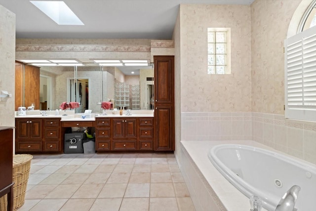 4322 N Mayan Dr, Hernando, FL 34442 - full bathroom with vanity, a tub with jets, a skylight, wallpapered walls, and tile patterned floors