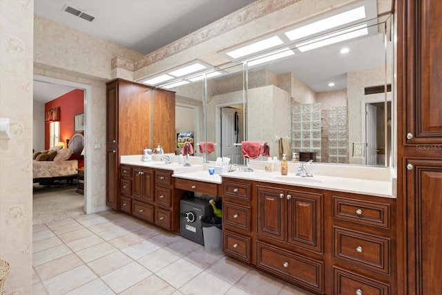 4322 N Mayan Dr, Hernando, FL 34442 - ensuite bathroom with double vanity, tile patterned floors, and tiled shower
