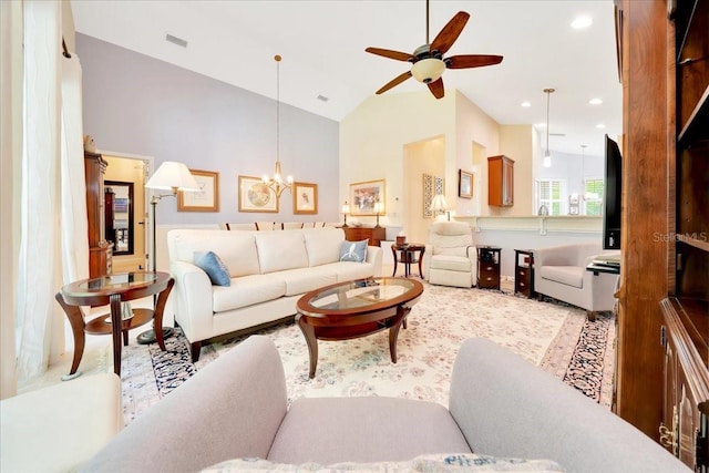 814 Copperhead Cir, Saint Augustine, FL 32092 - living room with a ceiling fan, high vaulted ceiling, a chandelier, and light wood finished floors