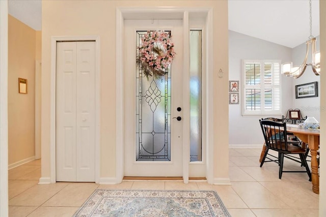 814 Copperhead Cir, Saint Augustine, FL 32092 - entryway with a chandelier, light tile patterned floors, and lofted ceiling