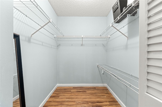 8400 SW 90th St Unit C, Ocala, FL 34481 - spacious closet featuring wood finished floors