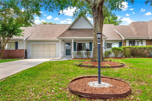 8400 SW 90th St Unit C, Ocala, FL 34481 - view of front facade featuring a garage, driveway, covered porch, and a front lawn