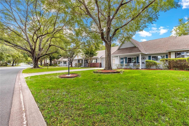 8400 SW 90th St Unit C, Ocala, FL 34481 - ranch-style home with a front lawn, a porch, and driveway