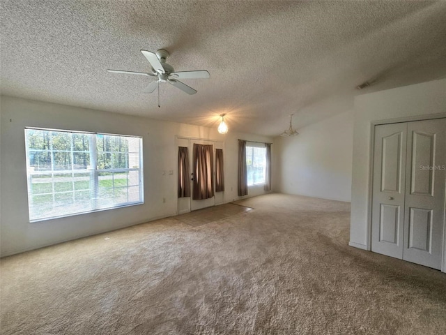 15483 Penn State Rd, Weeki Wachee, FL 34614 - carpeted spare room featuring a textured ceiling and a ceiling fan