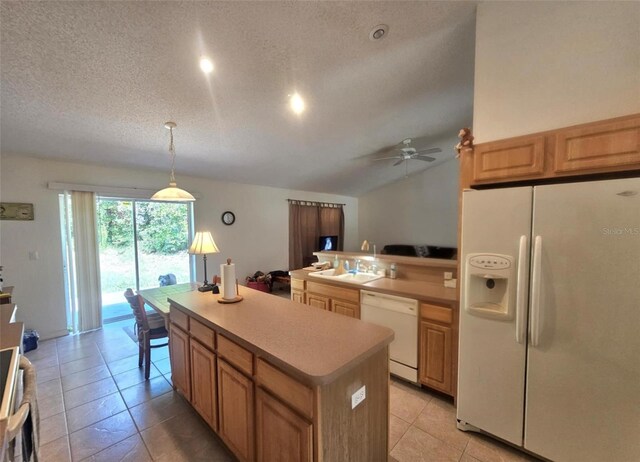 15483 Penn State Rd, Weeki Wachee, FL 34614 - kitchen featuring white appliances, a center island, a ceiling fan, a textured ceiling, and light countertops