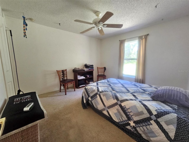 15483 Penn State Rd, Weeki Wachee, FL 34614 - carpeted bedroom with a textured ceiling and ceiling fan