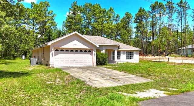 15483 Penn State Rd, Weeki Wachee, FL 34614 - ranch-style house with an attached garage, a front lawn, concrete driveway, and stucco siding
