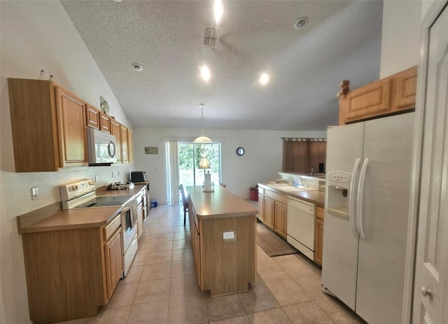 15483 Penn State Rd, Weeki Wachee, FL 34614 - kitchen with white appliances, a textured ceiling, a center island, lofted ceiling, and light tile patterned floors