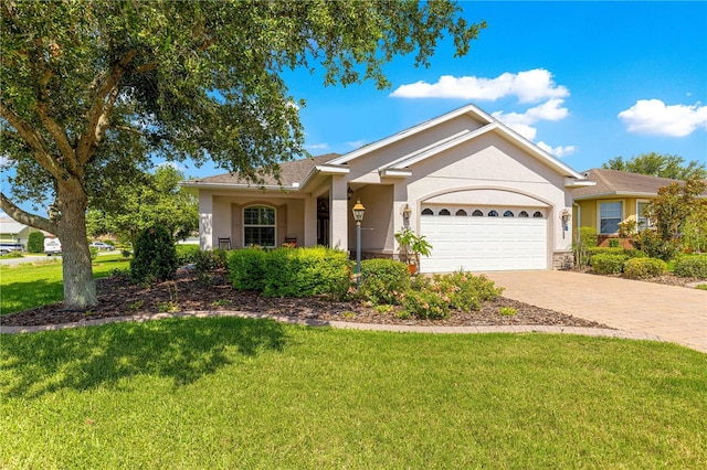 8566 SW 83rd Loop, Ocala, FL 34481 - ranch-style house featuring stucco siding, a garage, driveway, and a front yard
