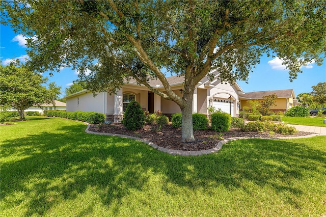 8566 SW 83rd Loop, Ocala, FL 34481 - view of front of house with stucco siding, a garage, and a front yard