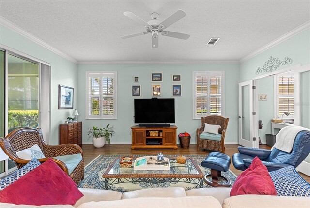 8566 SW 83rd Loop, Ocala, FL 34481 - living room with wood finished floors, ornamental molding, a textured ceiling, ceiling fan, and french doors
