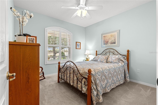 8566 SW 83rd Loop, Ocala, FL 34481 - carpeted bedroom featuring a textured ceiling and a ceiling fan