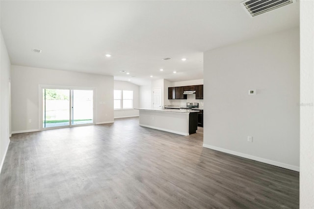 6865 SW 153 Place Rd, Ocala, FL 34473 - unfurnished living room with wood finished floors and recessed lighting