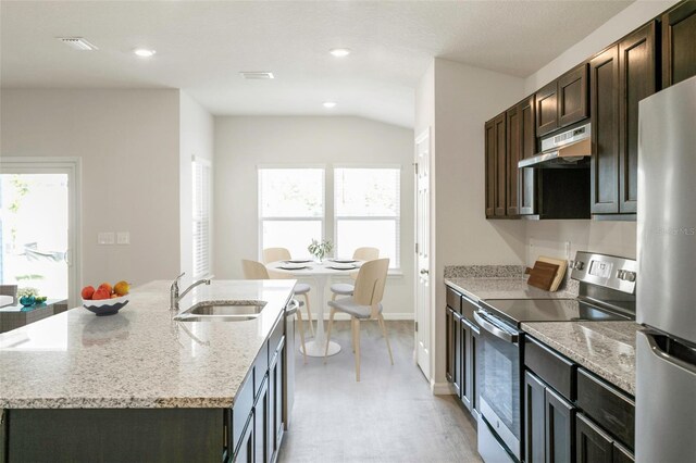 6865 SW 153 Place Rd, Ocala, FL 34473 - kitchen featuring stainless steel range with electric stovetop, under cabinet range hood, freestanding refrigerator, recessed lighting, and light stone counters