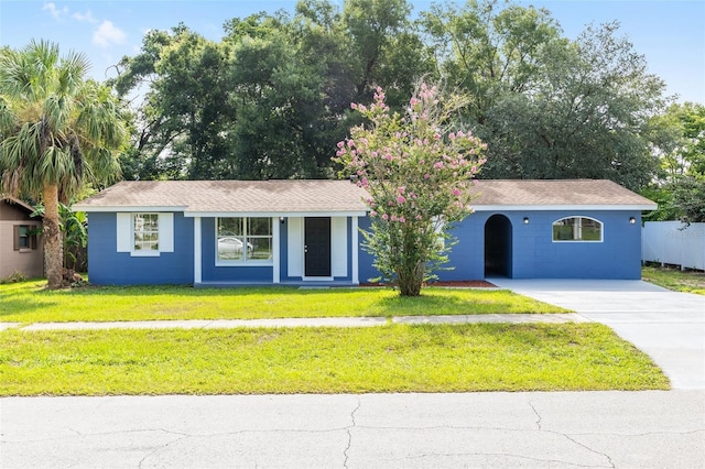 14761 SW 35th Terrace Rd, Ocala, FL 34473 - ranch-style house with concrete driveway and a front lawn