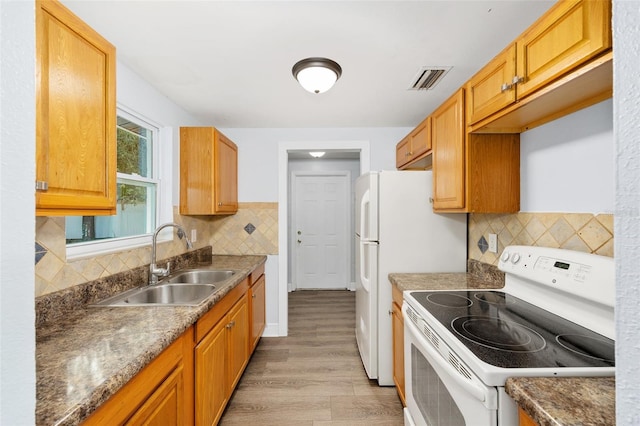 14761 SW 35th Terrace Rd, Ocala, FL 34473 - kitchen featuring white electric stove, light wood-type flooring, and tasteful backsplash